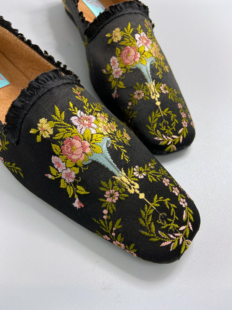 Black silk regency slipper shoes with floral embroidered posy motif. Squared toes and black silk satin ankle ribbons. Bohemian style created from antique textiles by the Pavilion Parade studio.