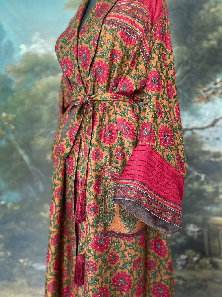 Vibrant ruby red, emerald green, and saffron fine wool robe with block printed paisley boteh pure silk lining. Wide sleeves, deep pockets and tassel sash belt. Bohemian style created from vintage and antique textiles by the Pavilion Parade studio