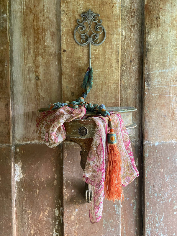 1920s style long silk sautoir necklace with antique tassel embellishment. Bohemian style from vintage textiles by Pavilion Parade. 