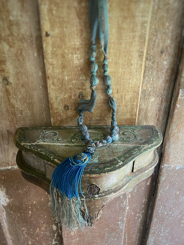 1920s style long silk sautoir necklace with antique tassel embellishment. Bohemian style from vintage textiles by Pavilion Parade. 