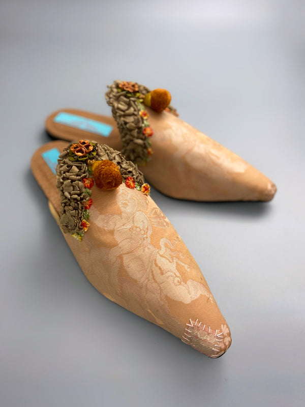 Apricot silk damask cherub shoes with pompom tassels, sustainably created from antique textiles by the Pavilion Parade studio