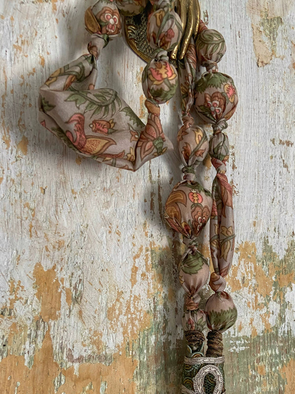 Aesthetic Movement inspired long silk sautoir necklace with antique tassel embellishment. Bohemian style from vintage textiles by Pavilion Parade. 