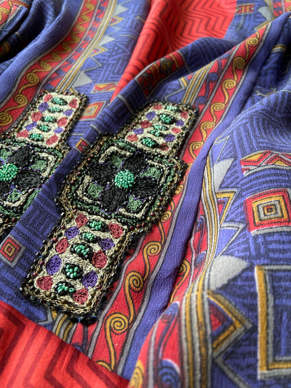 Egyptian Revival 1920s inspired full length robe created from vintage and antique textiles. Lapiz lazuli blue and scarlet silk crepe. Lined in block printed silk with design of ancient Egyptian figures, pyramids, chariots. Bohemian style from Pavilion Parade.