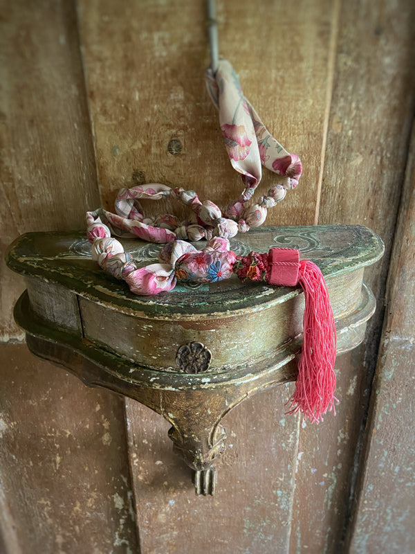 1920s style long silk sautoir necklace with antique tassel embellishment. Bohemian style from vintage textiles by Pavilion Parade. 