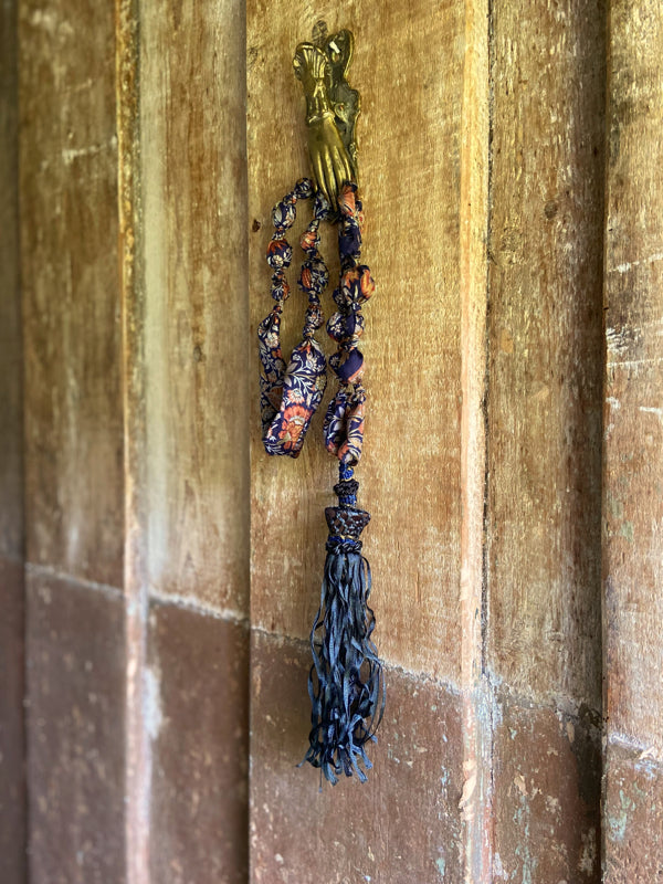 1920s style long silk sautoir necklace with antique tassel embellishment. Bohemian style from vintage textiles by Pavilion Parade. 