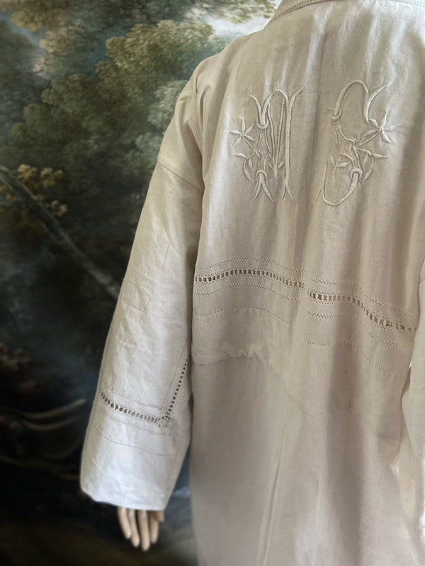 Full length kimono inspired robe with large patch pockets and wide sleeves. Created from an antique heavy French linen trousseau sheet with heirloom embroidery and drawn thread work. All French seamed with hand finished hems and collar. Bohemian styles sustainably created from antique and vintage textiles by the Pavilion Parade studio.
