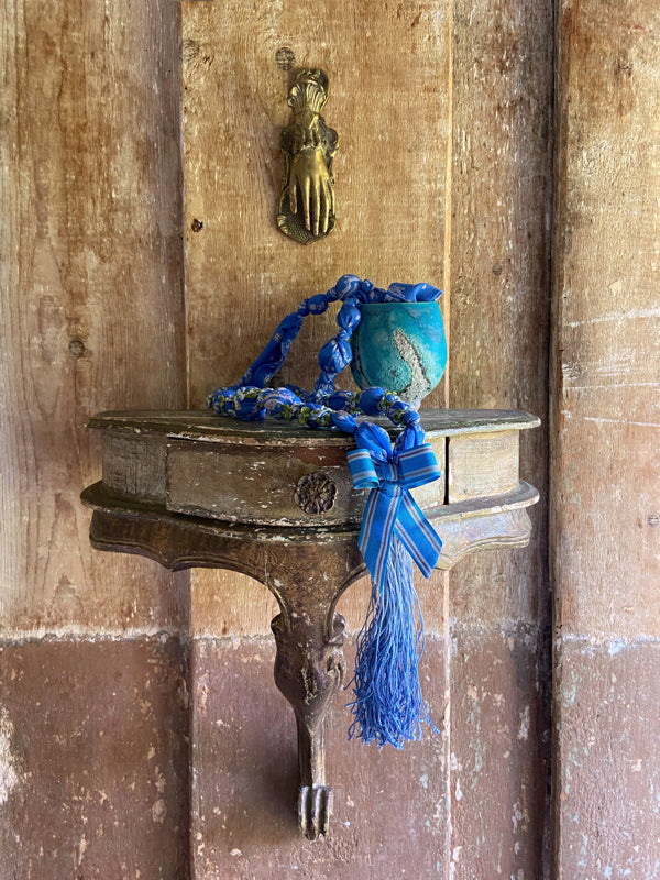 1920s style long silk sautoir necklace with antique tassel embellishment. Bohemian style from vintage textiles by Pavilion Parade. 