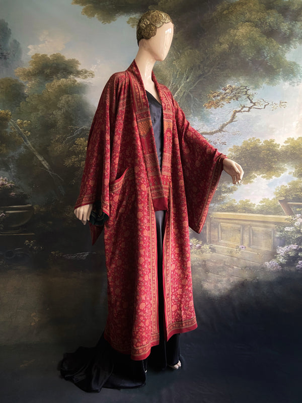Full length 1920s inspired kimono robe with large patch pockets. Newly created from a claret red, apricot and sage vintage silk crepe. Fully lined in silk with French seams throughout. Bohemian styles sustainably created from antique and vintage textiles by the Pavilion Parade studio.