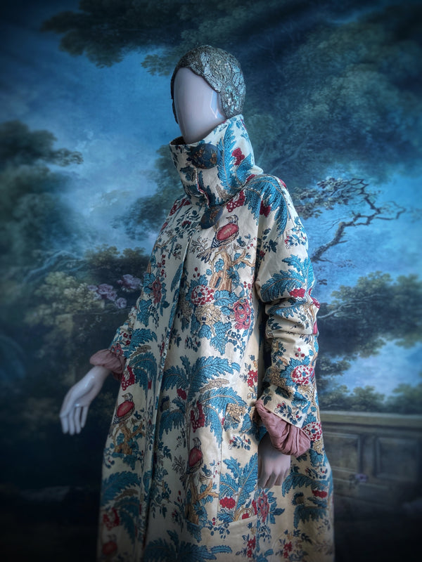 Funnel neck opera coat created from a vintage cotton Indienne featuring exotic birds and florals. Bohemian style created from vintage and antique textiles by Pavilion Parade