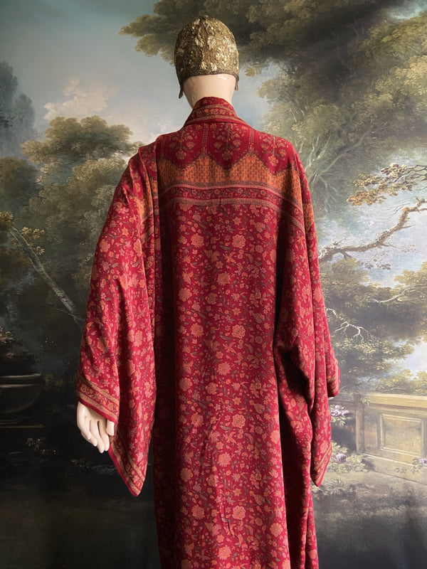 Full length 1920s inspired kimono robe with large patch pockets. Newly created from a claret red, apricot and sage vintage silk crepe. Fully lined in silk with French seams throughout. Bohemian styles sustainably created from antique and vintage textiles by the Pavilion Parade studio.