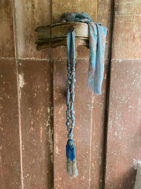 1920s style long silk sautoir necklace with antique tassel embellishment. Bohemian style from vintage textiles by Pavilion Parade. 