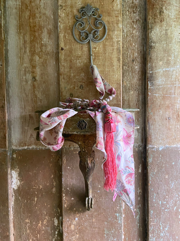 1920s style long silk sautoir necklace with antique tassel embellishment. Bohemian style from vintage textiles by Pavilion Parade. 