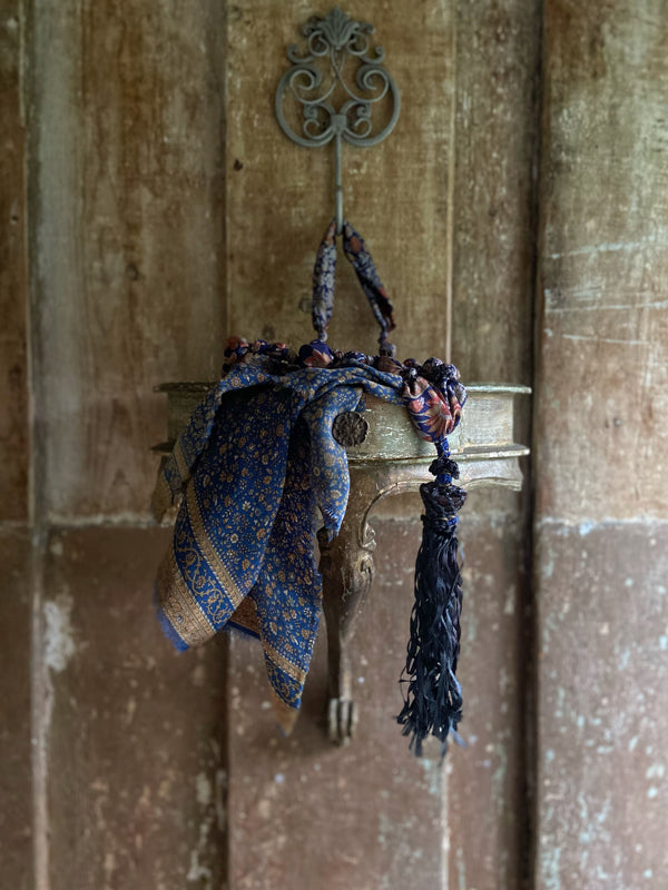 1920s style long silk sautoir necklace with antique tassel embellishment. Bohemian style from vintage textiles by Pavilion Parade. 