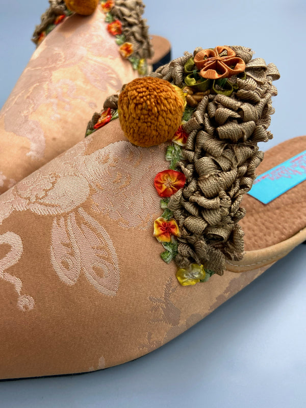 Apricot silk damask cherub shoes with pompom tassels, sustainably created from antique textiles by the Pavilion Parade studio