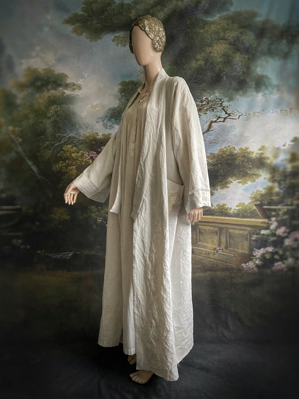 Full length kimono inspired robe with large patch pockets and wide sleeves. Created from an antique heavy French linen trousseau sheet with heirloom embroidery and drawn thread work. All French seamed with hand finished hems and collar. Bohemian styles sustainably created from antique and vintage textiles by the Pavilion Parade studio.

