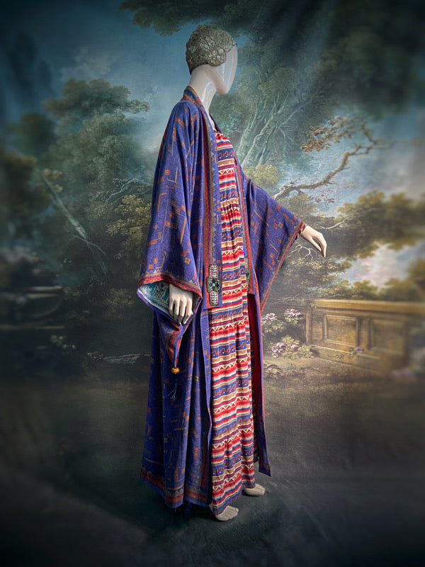 Egyptian Revival 1920s inspired full length robe created from vintage and antique textiles. Lapiz lazuli blue and scarlet silk crepe. Lined in block printed silk with design of ancient Egyptian figures, pyramids, chariots. Bohemian style from Pavilion Parade.