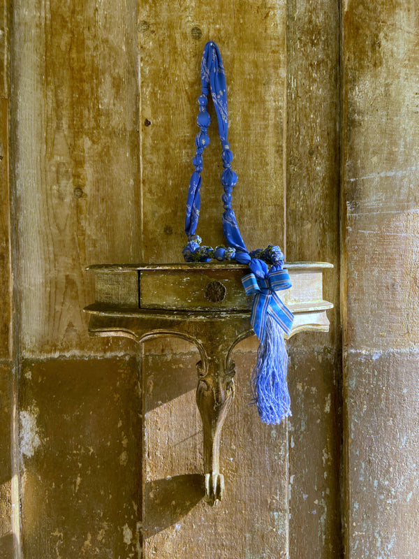 1920s style long silk sautoir necklace with antique tassel embellishment. Bohemian style from vintage textiles by Pavilion Parade. 