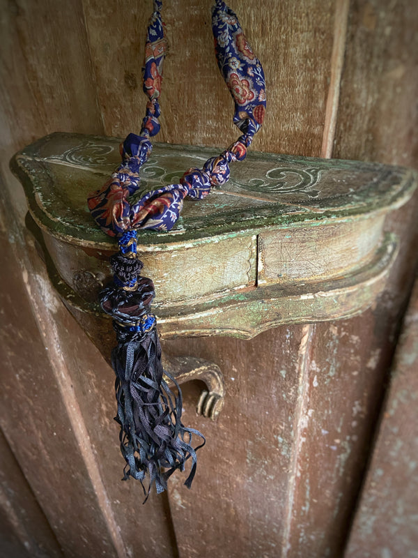 1920s style long silk sautoir necklace with antique tassel embellishment. Bohemian style from vintage textiles by Pavilion Parade. 