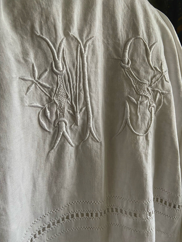 Full length kimono inspired robe with large patch pockets and wide sleeves. Created from an antique heavy French linen trousseau sheet with heirloom embroidery and drawn thread work. All French seamed with hand finished hems and collar. Bohemian styles sustainably created from antique and vintage textiles by the Pavilion Parade studio.
