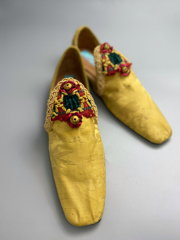 Golden yellow antique silk shoes with red and green silk chenille passementerie braid embellishment. Bohemian styles by Pavilion Parade