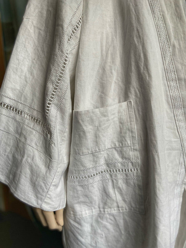 Full length kimono inspired robe with large patch pockets and wide sleeves. Created from an antique heavy French linen trousseau sheet with heirloom embroidery and drawn thread work. All French seamed with hand finished hems and collar. Bohemian styles sustainably created from antique and vintage textiles by the Pavilion Parade studio.
