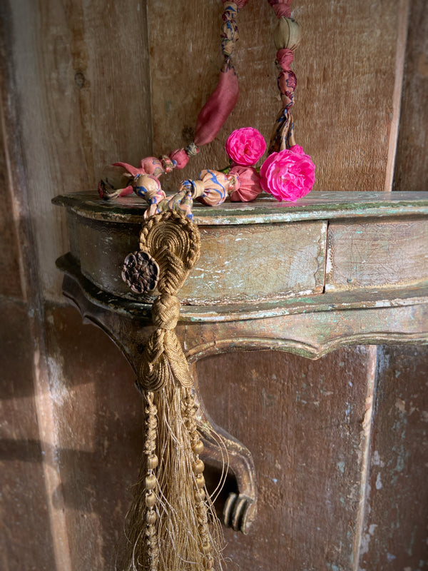 1920s style long silk sautoir necklace with antique tassel embellishment. Bohemian style from vintage textiles by Pavilion Parade. 