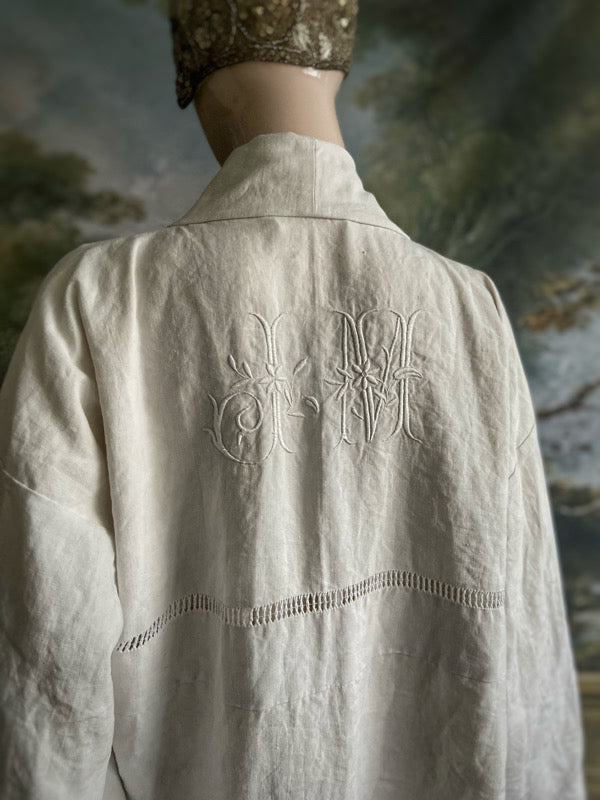 Full length kimono inspired robe with large patch pockets and wide sleeves. Created from an antique heavy French linen trousseau sheet with heirloom embroidery and drawn thread work. All French seamed with hand finished hems and collar. Bohemian styles sustainably created from antique and vintage textiles by the Pavilion Parade studio.
