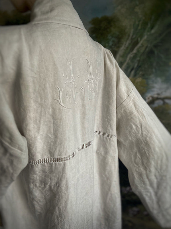 Full length kimono inspired robe with large patch pockets and wide sleeves. Created from an antique heavy French linen trousseau sheet with heirloom embroidery and drawn thread work. All French seamed with hand finished hems and collar. Bohemian styles sustainably created from antique and vintage textiles by the Pavilion Parade studio.
