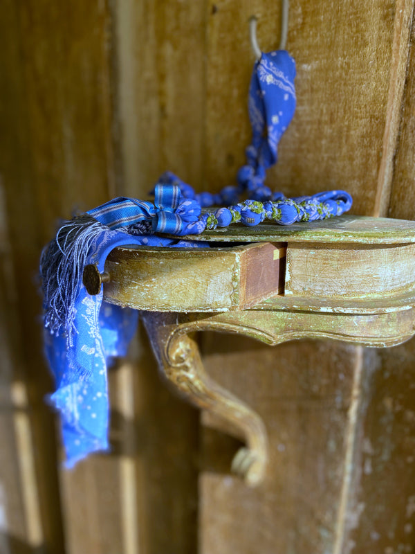 1920s style long silk sautoir necklace with antique tassel embellishment. Bohemian style from vintage textiles by Pavilion Parade. 