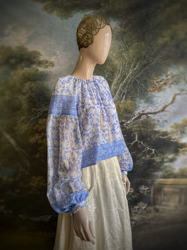 China blue and white cotton muslin block printed blouse with long full sleeves and adjustable drawstring neckline. Bohemian styles sustainably created from antique and vintage textiles by the Pavilion Parade studio. 