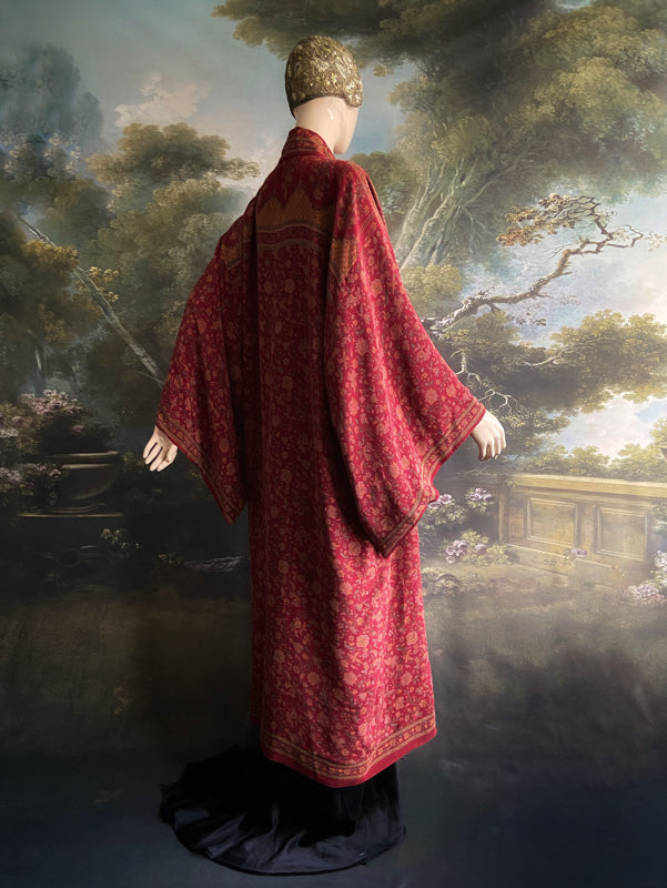 Full length 1920s inspired kimono robe with large patch pockets. Newly created from a claret red, apricot and sage vintage silk crepe. Fully lined in silk with French seams throughout. Bohemian styles sustainably created from antique and vintage textiles by the Pavilion Parade studio.