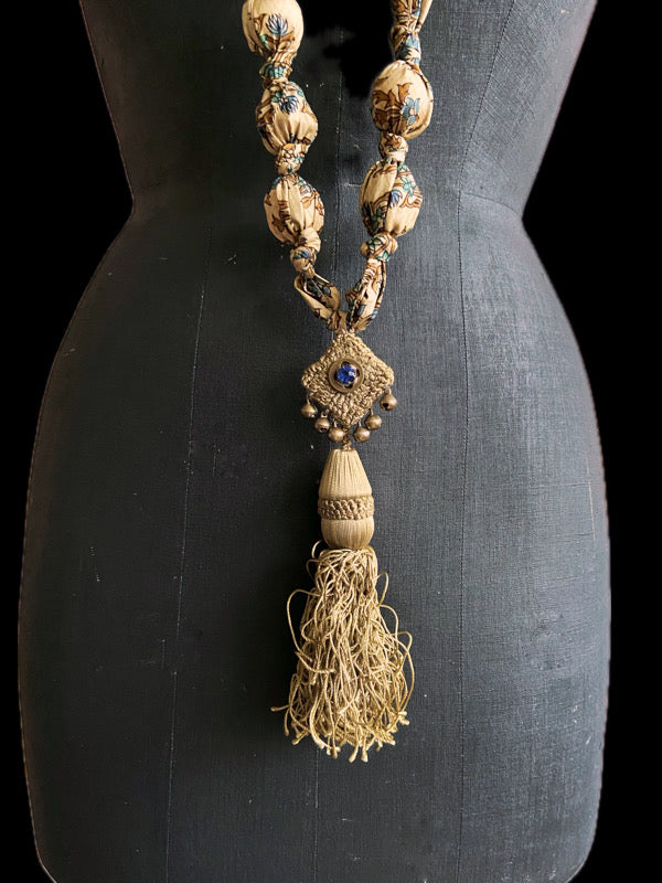 1920s style long silk sautoir necklace with antique tassel embellishment. Bohemian style from vintage textiles by Pavilion Parade. 