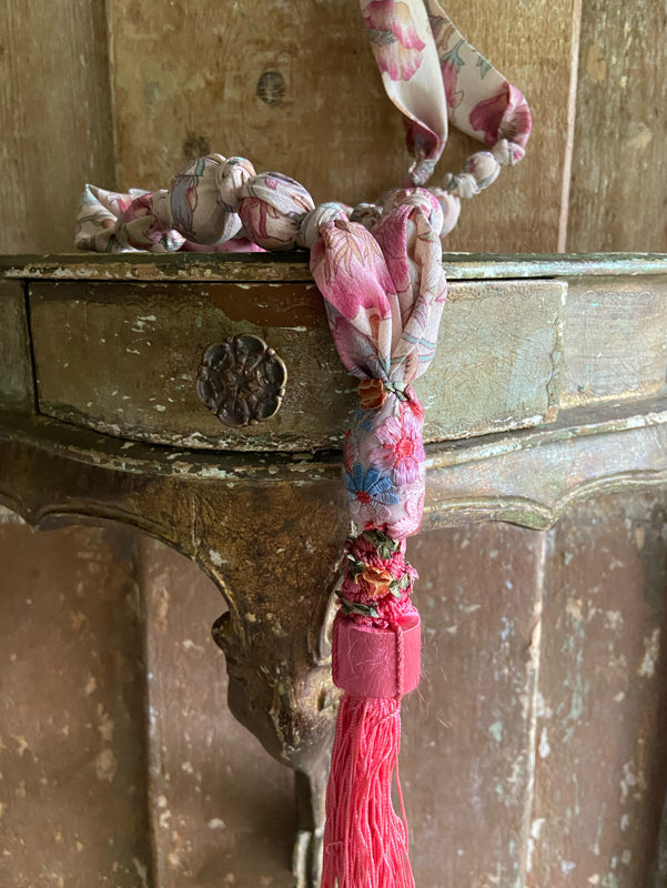 1920s style long silk sautoir necklace with antique tassel embellishment. Bohemian style from vintage textiles by Pavilion Parade. 