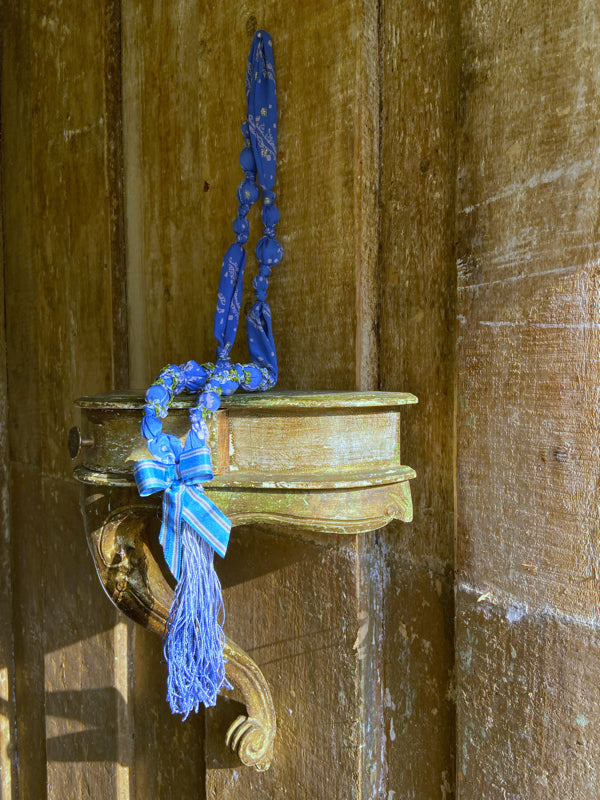 1920s style long silk sautoir necklace with antique tassel embellishment. Bohemian style from vintage textiles by Pavilion Parade. 