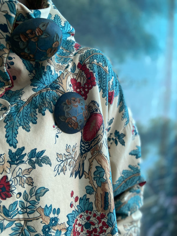Funnel neck opera coat created from a vintage cotton Indienne featuring exotic birds and florals. Bohemian style created from vintage and antique textiles by Pavilion Parade