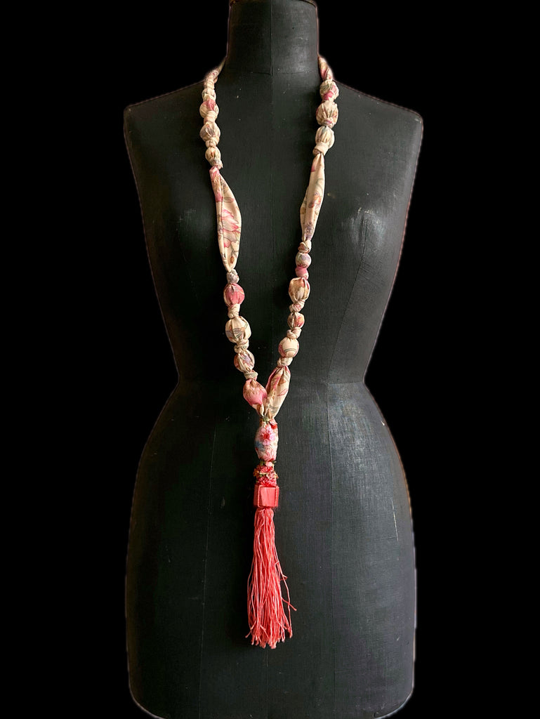 1920s style long silk sautoir necklace with antique tassel embellishment. Bohemian style from vintage textiles by Pavilion Parade. 