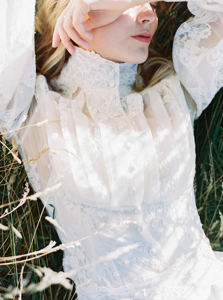 Ivory French lace and silk organza fitted romantic blouse. Antique lace elements at high fitted collar and cuffs. Full bishop sleeves and pleated bodice front. A flight of fancy from the Pavilion Parade studio. Photo by Mariel Hannah.