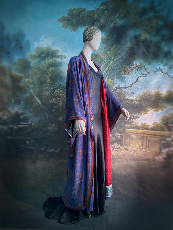 Egyptian Revival 1920s inspired full length robe created from vintage and antique textiles. Lapiz lazuli blue and scarlet silk crepe. Lined in block printed silk with design of ancient Egyptian figures, pyramids, chariots. Bohemian style from Pavilion Parade.