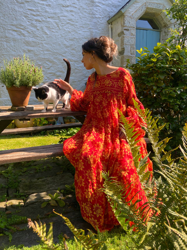 Scarlet red and sunflower yellow cotton voile volume dress with balloon sleeves and side pockets. Bohemian Aesthetic style by the Pavilion Parade studio.