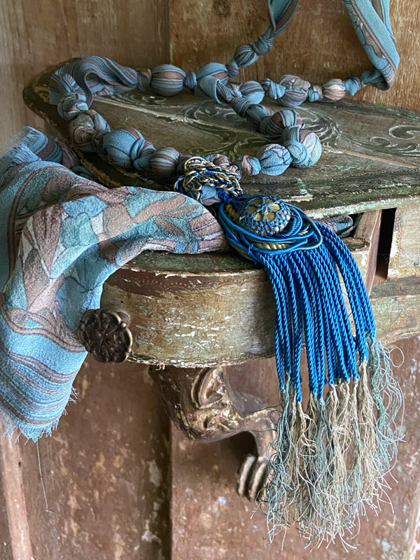 1920s style long silk sautoir necklace with antique tassel embellishment. Bohemian style from vintage textiles by Pavilion Parade. 
