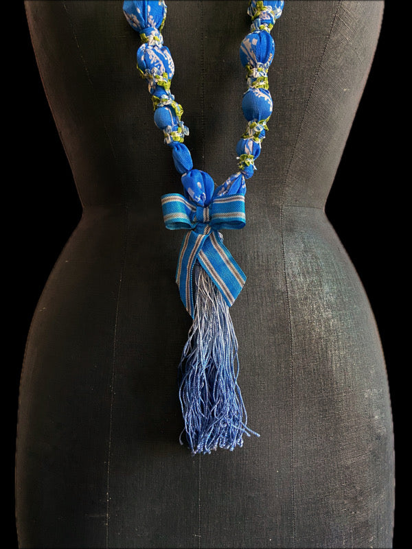 1920s style long silk sautoir necklace with antique tassel embellishment. Bohemian style from vintage textiles by Pavilion Parade. 
