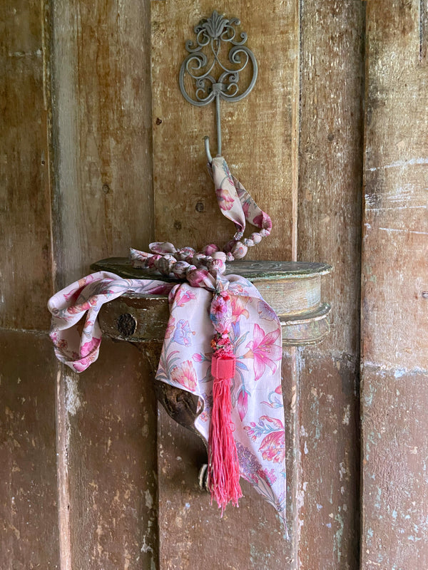 1920s style long silk sautoir necklace with antique tassel embellishment. Bohemian style from vintage textiles by Pavilion Parade. 