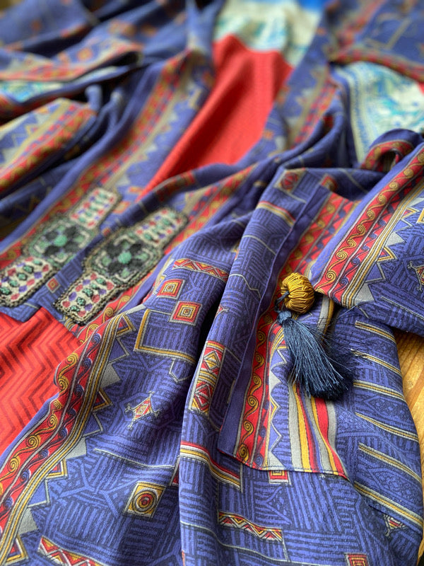 Egyptian Revival 1920s inspired full length robe created from vintage and antique textiles. Lapiz lazuli blue and scarlet silk crepe. Lined in block printed silk with design of ancient Egyptian figures, pyramids, chariots. Bohemian style from Pavilion Parade.