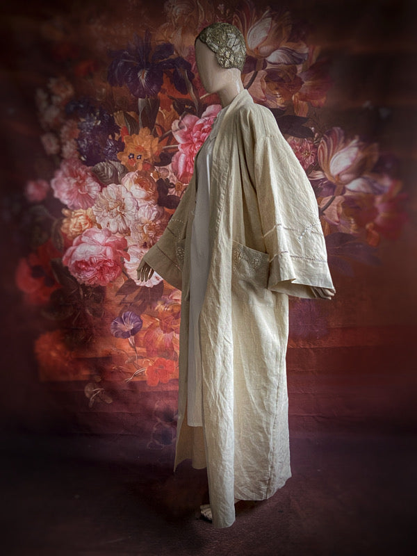 Full length kimono inspired robe with large patch pockets and wide sleeves. Created from an antique heavy French linen trousseau sheet with heirloom embroidery and drawn thread work. All French seamed with hand finished hems and collar. Bohemian styles sustainably created from antique and vintage textiles by the Pavilion Parade studio.