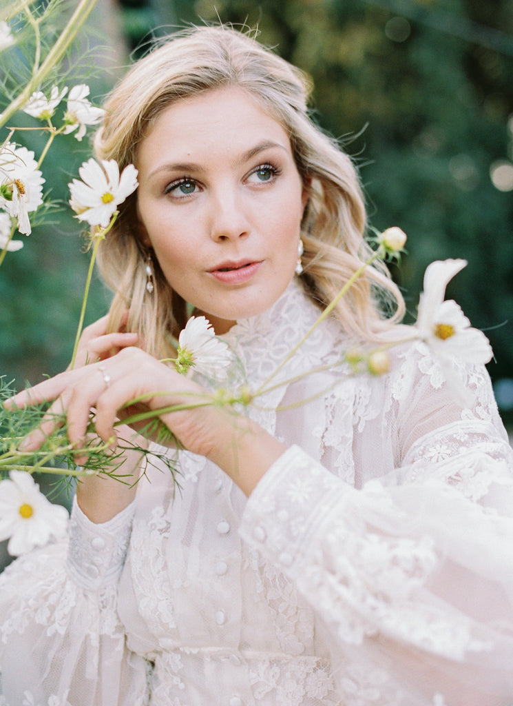 Ivory French lace and silk organza fitted romantic blouse. Antique lace elements at high fitted collar and cuffs. Full bishop sleeves and pleated bodice front. A flight of fancy from the Pavilion Parade studio. Photo by Mariel Hannah.
