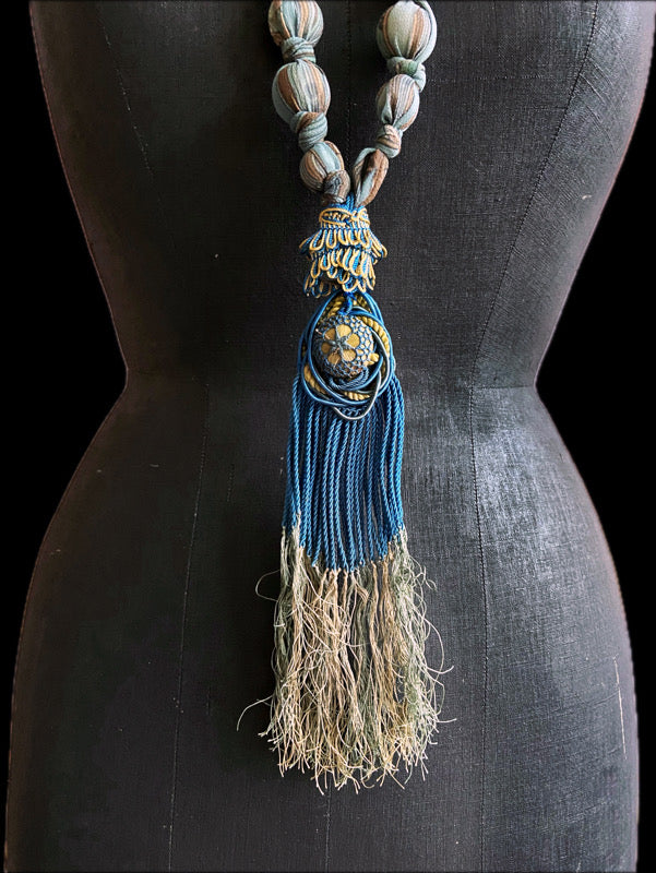 1920s style long silk sautoir necklace with antique tassel embellishment. Bohemian style from vintage textiles by Pavilion Parade. 