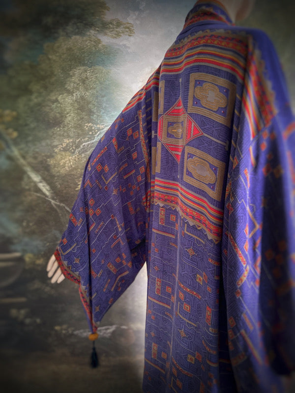Egyptian Revival 1920s inspired full length robe created from vintage and antique textiles. Lapiz lazuli blue and scarlet silk crepe. Lined in block printed silk with design of ancient Egyptian figures, pyramids, chariots. Bohemian style from Pavilion Parade.