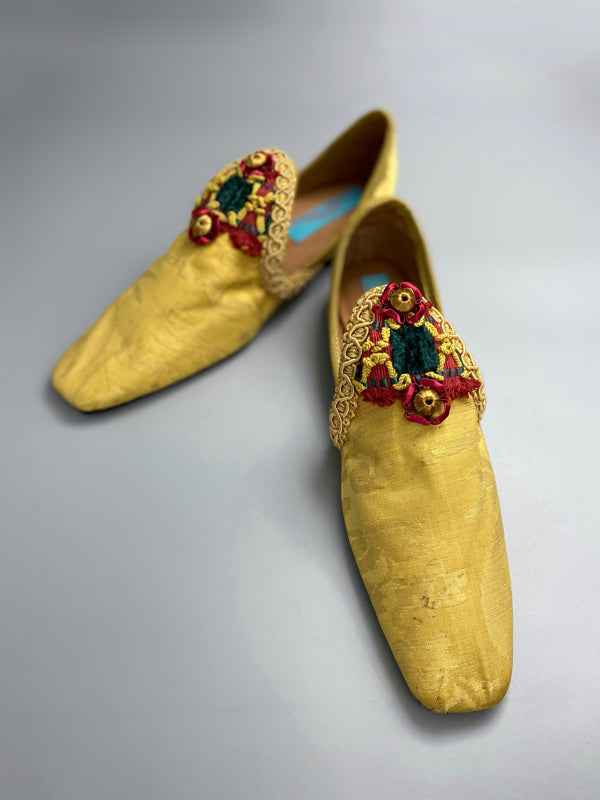 Golden yellow antique silk shoes with red and green silk chenille passementerie braid embellishment. Bohemian styles by Pavilion Parade