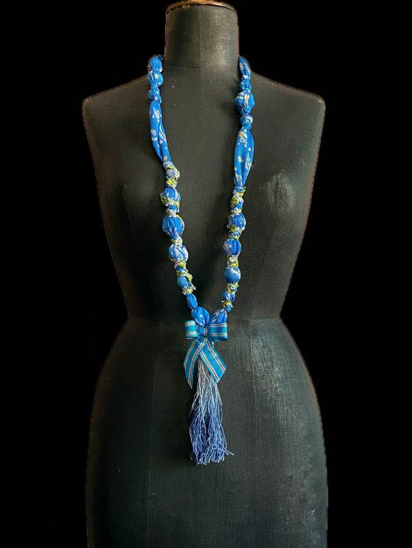 1920s style long silk sautoir necklace with antique tassel embellishment. Bohemian style from vintage textiles by Pavilion Parade. 