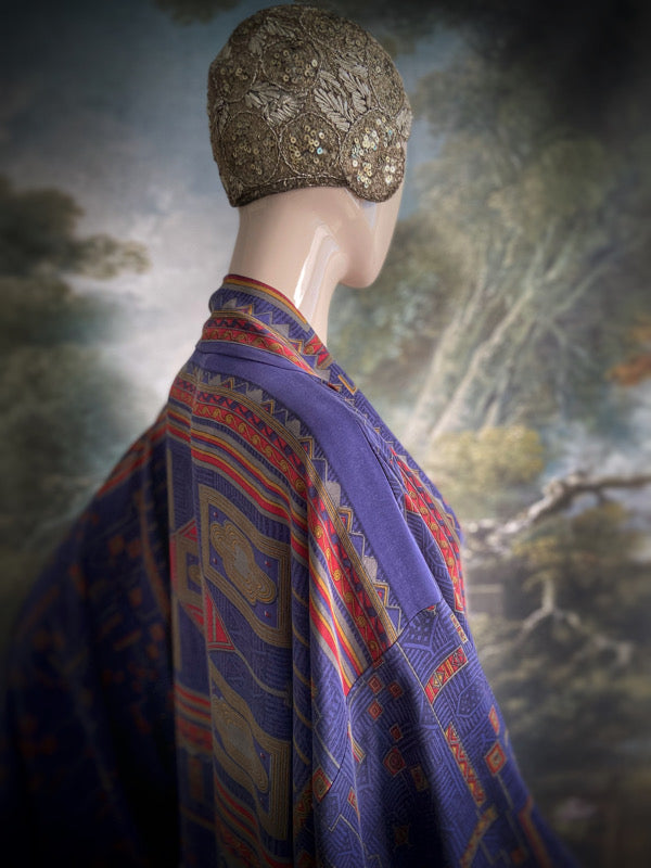 Egyptian Revival 1920s inspired full length robe created from vintage and antique textiles. Lapiz lazuli blue and scarlet silk crepe. Lined in block printed silk with design of ancient Egyptian figures, pyramids, chariots. Bohemian style from Pavilion Parade.